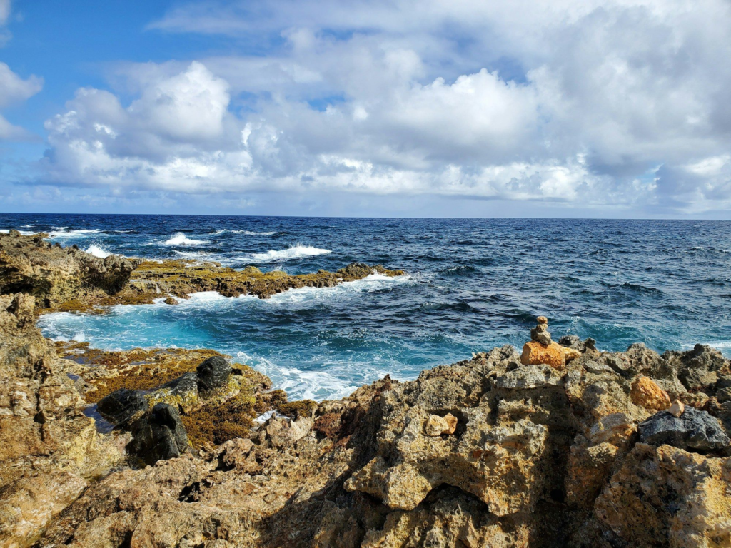 Jagged rocks and waves near the Natural Bridge area, Aruba