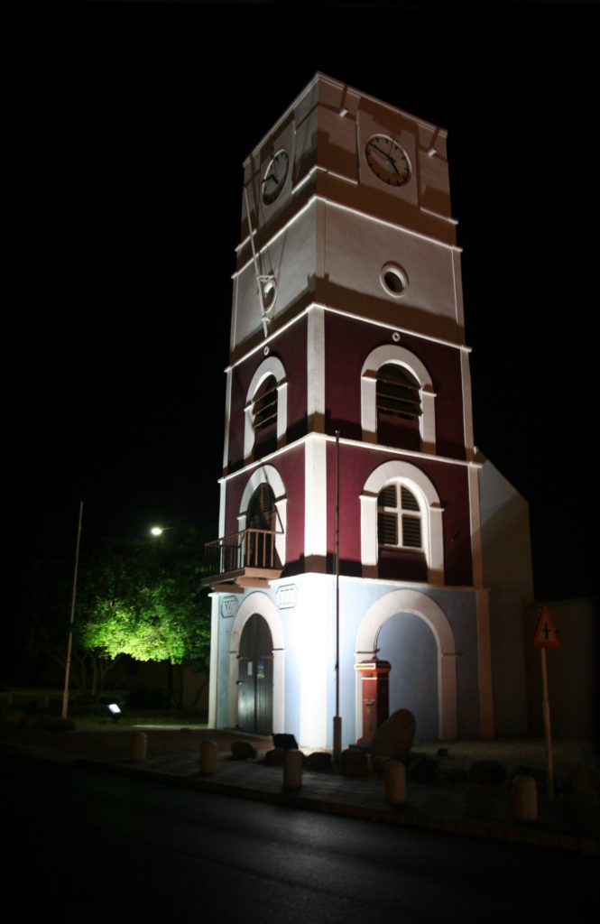 The Willem III Tower at Fort Zoutman, lit at night in Oranjestad