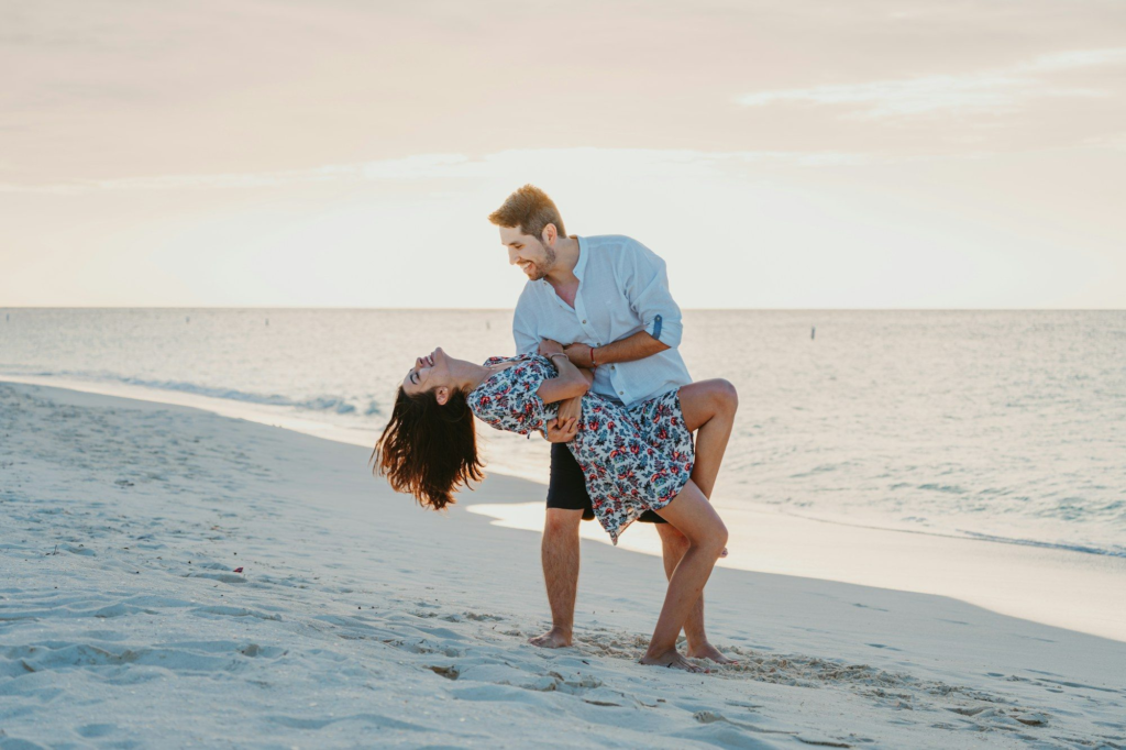 A couple dancing on Eagle Beach, Aruba, during golden hour