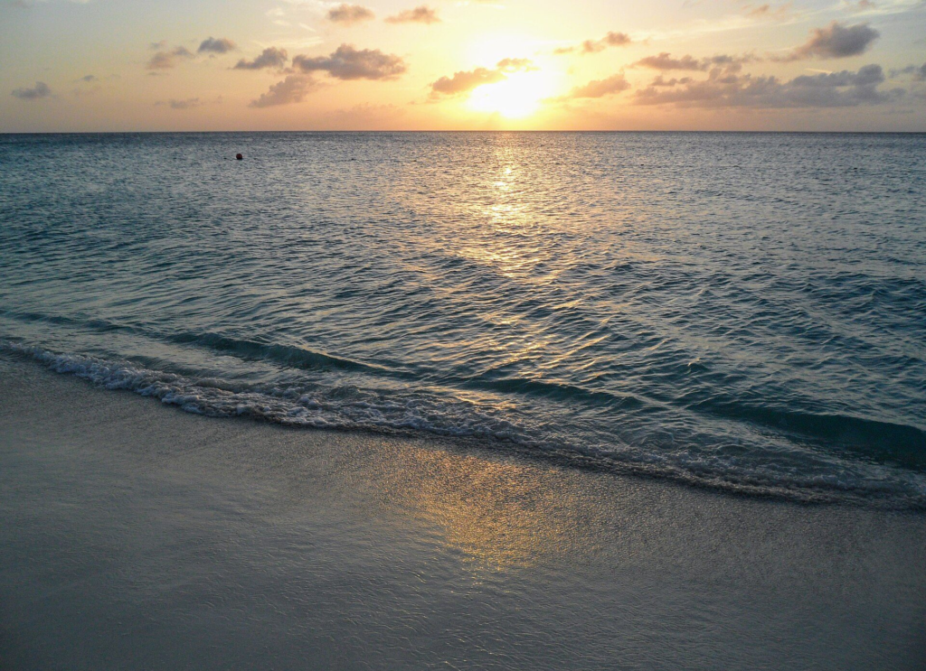 The sun setting over the sea at Eagle Beach, Aruba