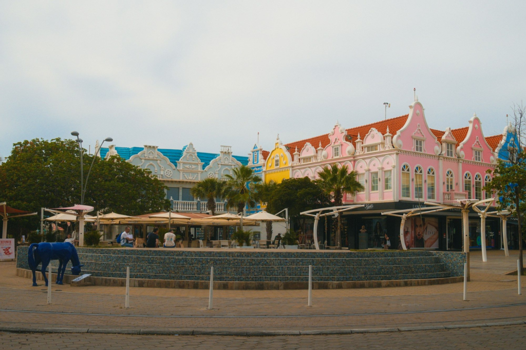 Colorful buildings with outdoor cafe seating in Aruba