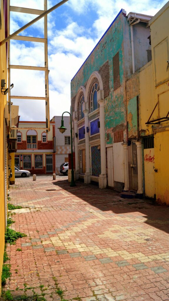 Quiet street with brightly painted buildings in San Nicolas, Aruba